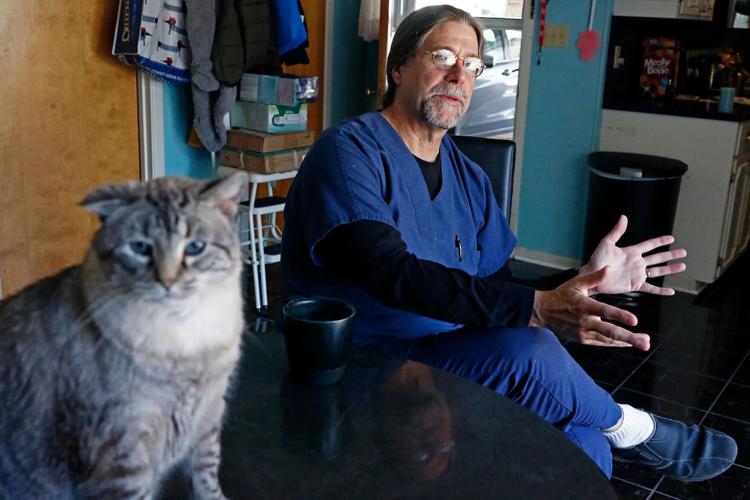 Gus-Mohamed-and-cat_AP17083164610930_AP-Photo-Rogelio-V.-Solis.jpg