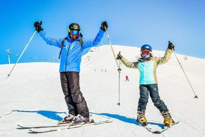 Skiing Family on the Mountain
