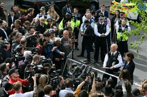 Police chief Mark Rowley was heckled at the scene