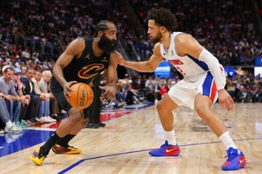 Detroit's Cade Cunningham (right) marks Cleveland's James Harden in the Pistons' series-opening win over the Cavaliers